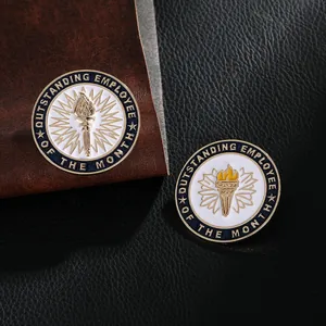 Macro detail of outstanding employee metal lapel pins with torch and blue enamel finish
