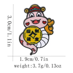 Detail showing cartoon snake enamel brooch dimensions with gold coin and red official hat