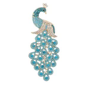 Exquisite gold peacock brooch pin featuring vibrant blue rhinestones and crystal accents