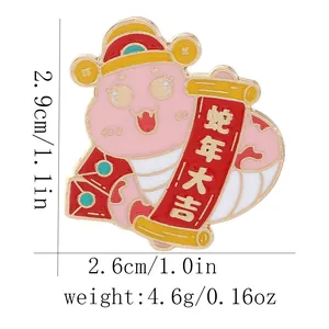 Detailed view showing dimensions of cute pink enamel snake brooch with New Year scroll