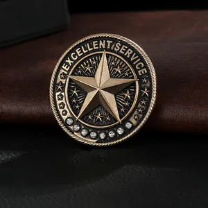 Macro detail of alloy award brooch featuring five-pointed star and EXCELLENT SERVICE text