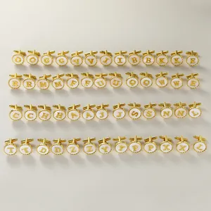 Detailed grid showing all 26 gold alphabet cufflinks with white inlaid base