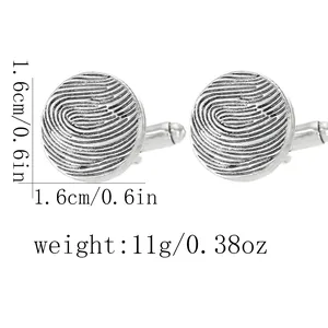 Detailed view of silver-plated cufflinks with engraved fingerprint pattern and dimensions
