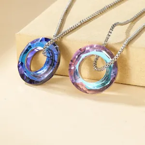 Dual circular faceted crystal pendant necklaces with blue and purple gradient effects