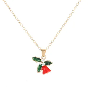 Christmas necklace with golden chain and green holly leaves with red bell pendant