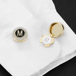 Gold plated letter M cufflink button covers with black enamel and white crystals