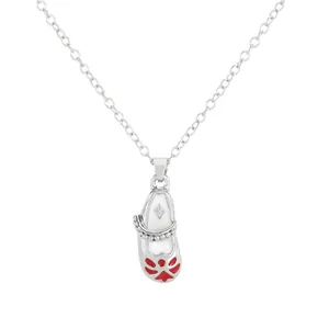 Silver O-chain necklace featuring white ballet shoe pendant with red flower details