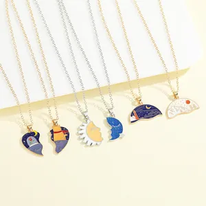Detailed set of enamel couple necklaces with cat, sun, moon and mountain pendants