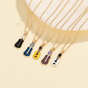 Close-up of enamel guitar and violin pendants in five vibrant colors with gold chains