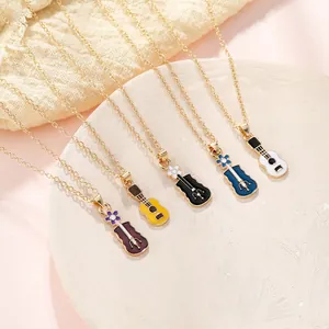 Colorful guitar pendant necklaces in gold-tone finish with floral engraving details