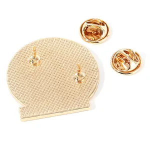 Retro vintage metal brooch back view with gold finish and double butterfly clutch pins