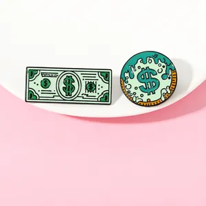 Macro detail of dollar sign and green banknote enamel pins on a white tray