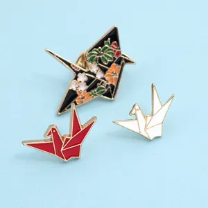 Japanese origami crane enamel brooches in black floral, red and white styles