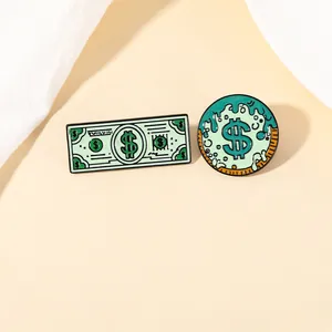 Detailed close-up of green banknote and melting dollar sign enamel brooch set