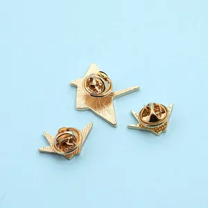 Three-piece gold metal crane and star brooches with secure butterfly clutch backs
