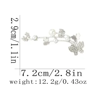 Detailed view of luxury butterfly pearl brooch with dimensions 7.2cm by 2.9cm and weight 12.2g