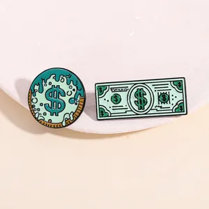 Detailed view of mint green dollar sign enamel pins on a soft pastel background