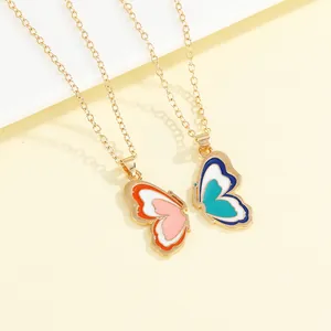 Matching butterfly necklace set with gold trim and vibrant colorful enamel inlay