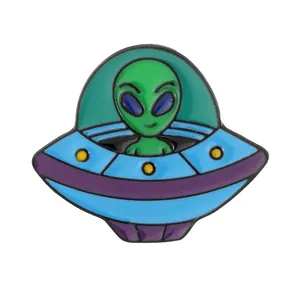 Creative enamel UFO lapel pin featuring a green alien in a blue spaceship for backpacks