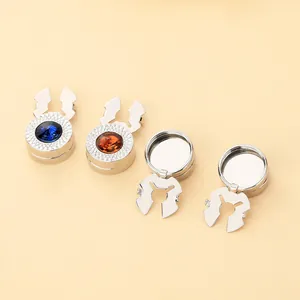 Detailed macro view of silver metal button covers with sparkling crystal inlays and clips