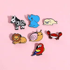 Detailed view of colorful cartoon animal enamel pins including zebra elephant and lion