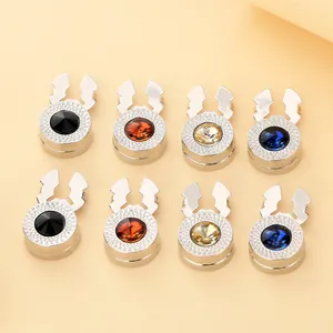 Eight-piece set of silver magnetic hijab clips with colorful rhinestones in a macro detail view