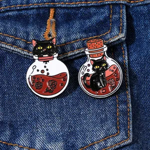Cartoon black cat potion bottle enamel pins set on blue denim fabric background