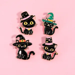 Set of four black enamel cat pins featuring wizard hats and spooky Halloween elements