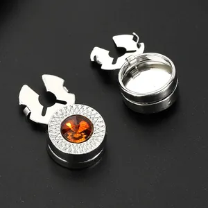 Detail of silver hinge button cover with orange gemstone and non-slip texture