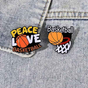 Set of two basketball enamel pins featuring Peace Love Basketball design on denim jacket