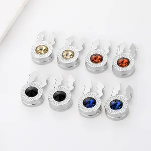 Detail of round magnetic clasps with grid texture and colorful faceted crystals