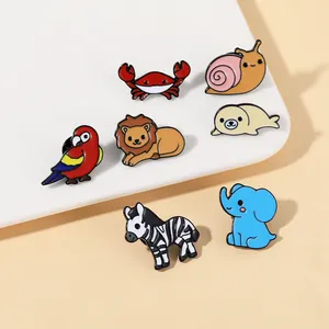 Detailed view of colorful enamel animal brooches set including elephant, lion and zebra pins