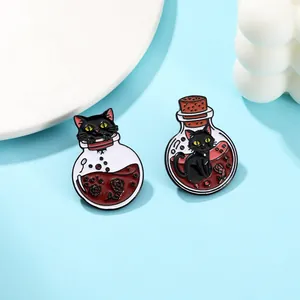 Detail of enamel pins featuring black cats in magic potion bottles with red roses