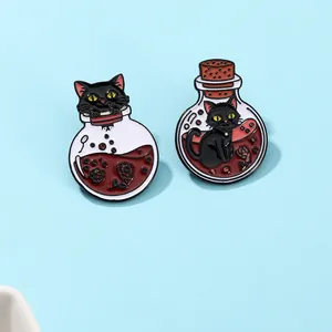 Close-up of enamel pins featuring a black cat with red potion bottles and rose detail