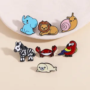 Close-up of colorful cartoon animal enamel pins including elephant, lion and zebra
