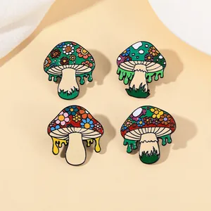 Detailed close-up of four mushroom enamel pins featuring floral patterns and drips