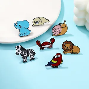 Detailed set of cute enamel pins featuring colorful animals on a light blue background