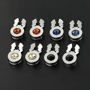 Macro detail of luxury copper button caps with colorful faceted gemstone inlays
