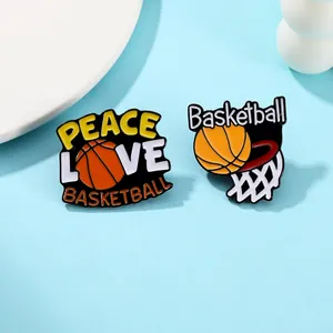 Macro detail of basketball enamel pins featuring Peace Love Basketball and net designs