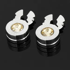 Silver metal cufflink featuring champagne gemstone and textured diamond pattern detail
