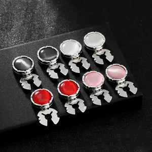 Gemelos redondos clásicos con piedras de ojo de gato de colores en base de plata