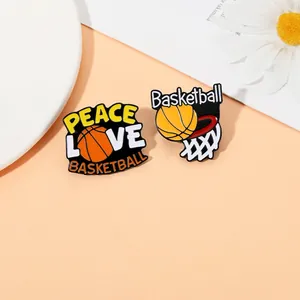 Detailed close-up of colorful enamel basketball pins with Peace Love and basketball motifs