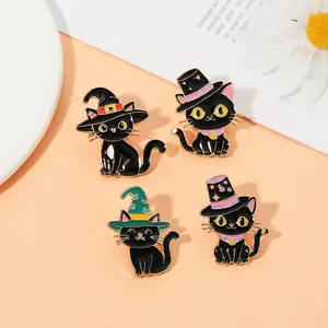 Detail shot of four black cat enamel pins with colorful wizard hats for Halloween decorations