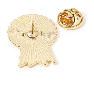 Golden medal shaped alloy brooch with textured back and secure butterfly clasp