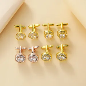 Detail of round and teardrop cufflink sets with gold finish and inlaid zircon stones