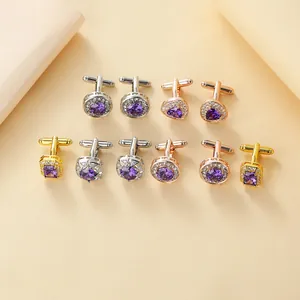 Detailed close-up of luxury metal cufflinks with round and heart shapes with purple zircon stones