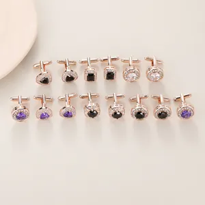 Close-up of assorted geometric cufflinks with inlaid colorful zircons in rose gold finish