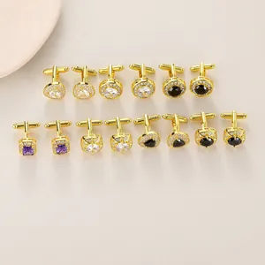 Flat lay of diverse gold-plated cufflink set with colorful zircon stones in various shapes