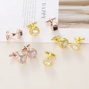 Macro shot of assorted round and square cufflinks with zircon stones in gold and rose gold