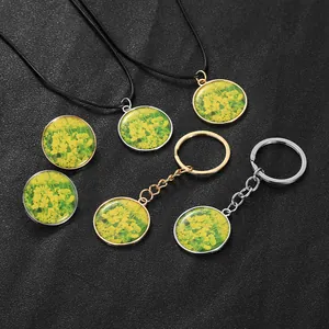 Detail showing vintage yellow rapeseed flower pendants with necklaces and keychains